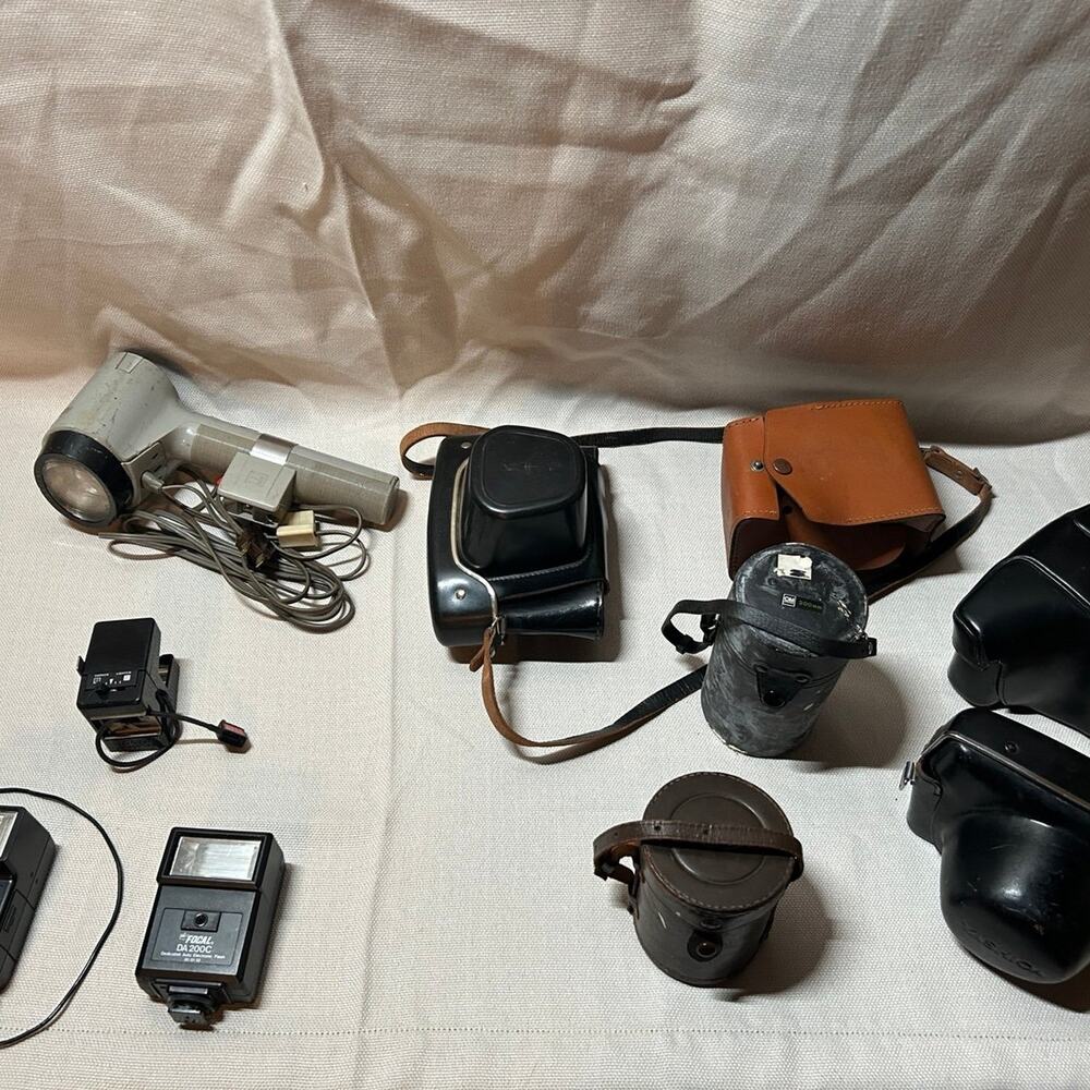 Vintage camera flashes and cases